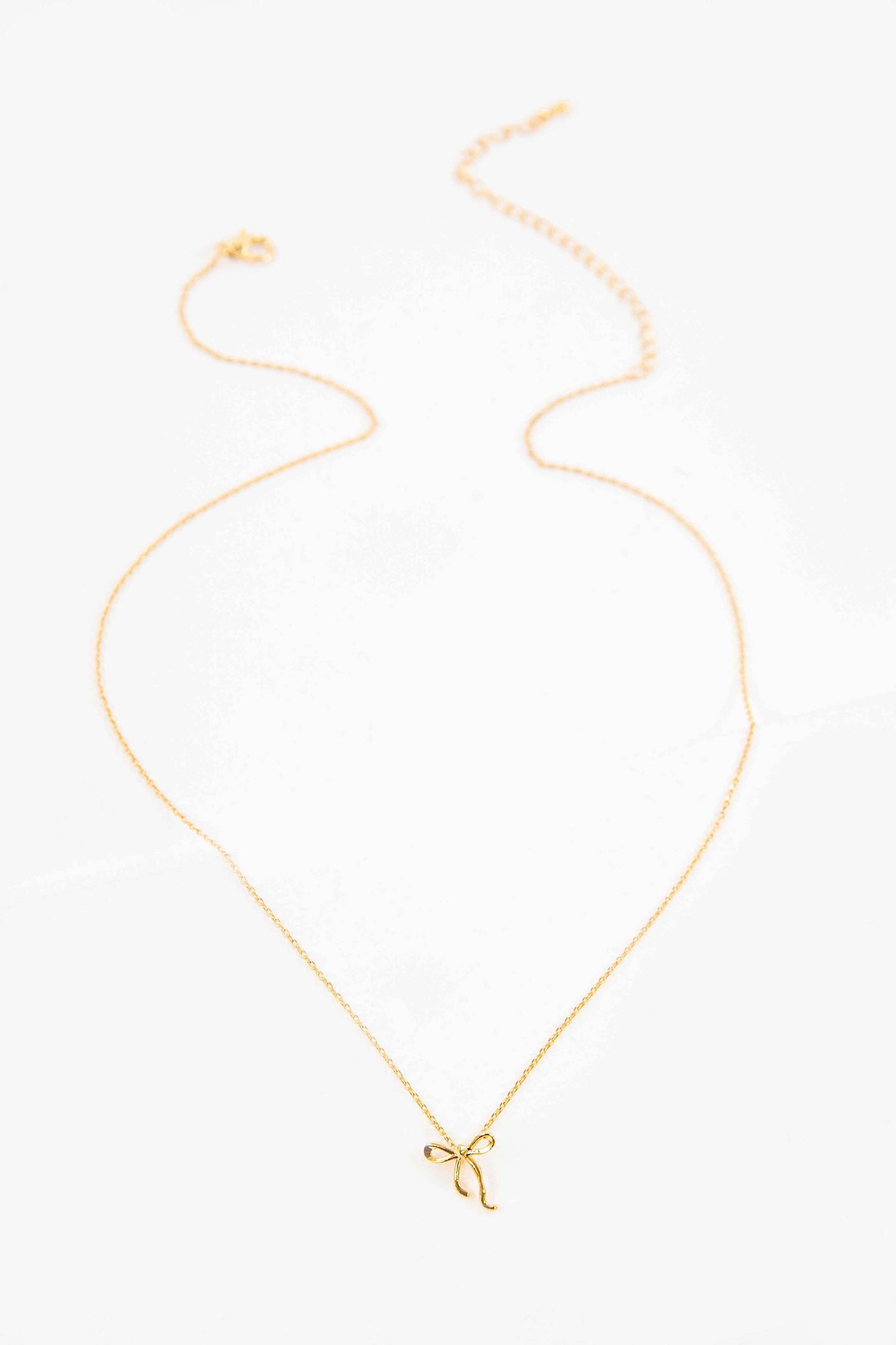 Gold Curled Bow Charm Necklace