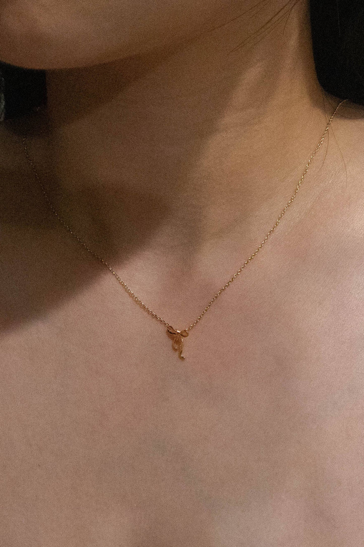 Gold Curled Bow Charm Necklace