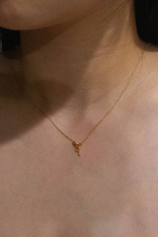 Gold Curled Bow Charm Necklace